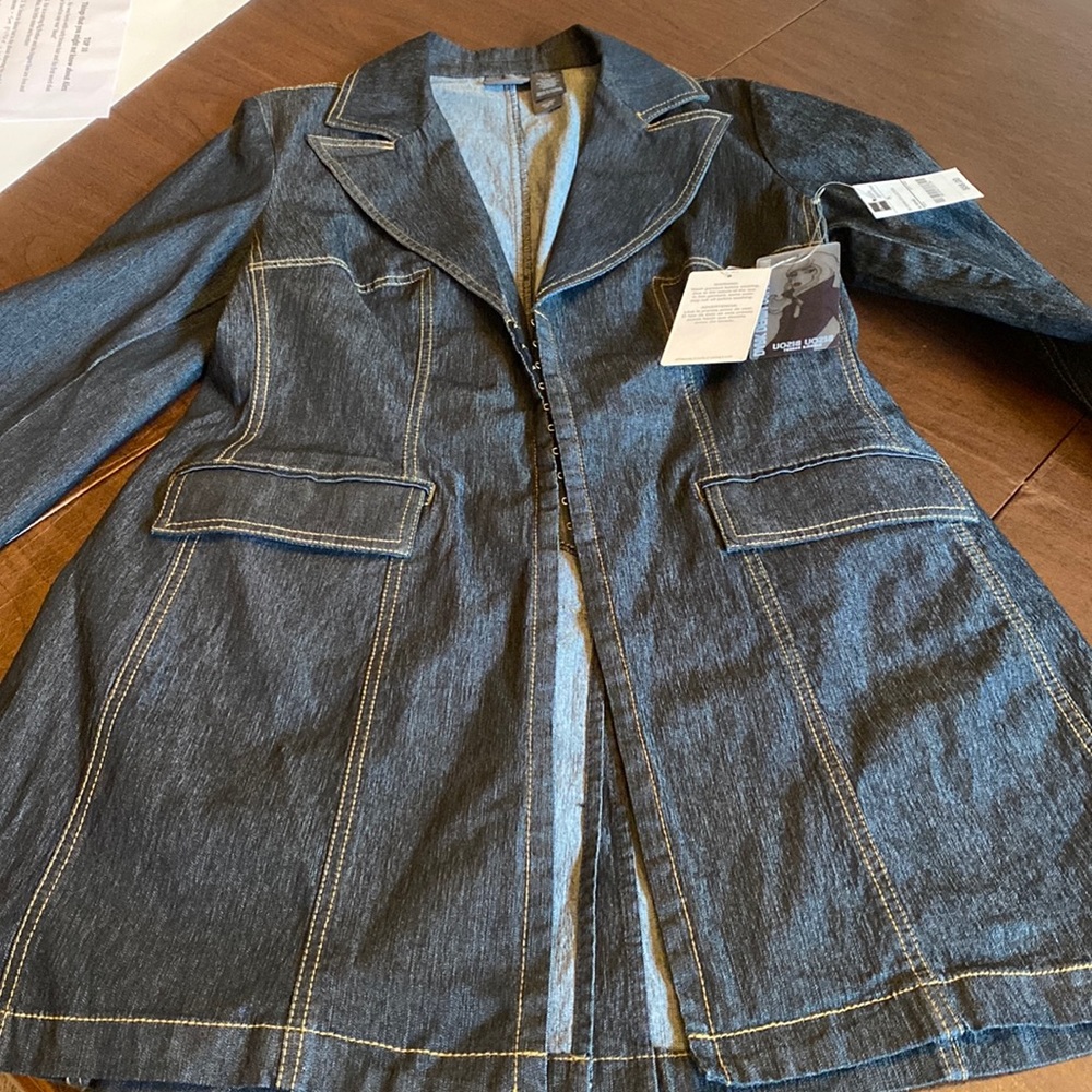 petite large dark denim jacket. Mid thigh with seam detail. Hook & eye closure